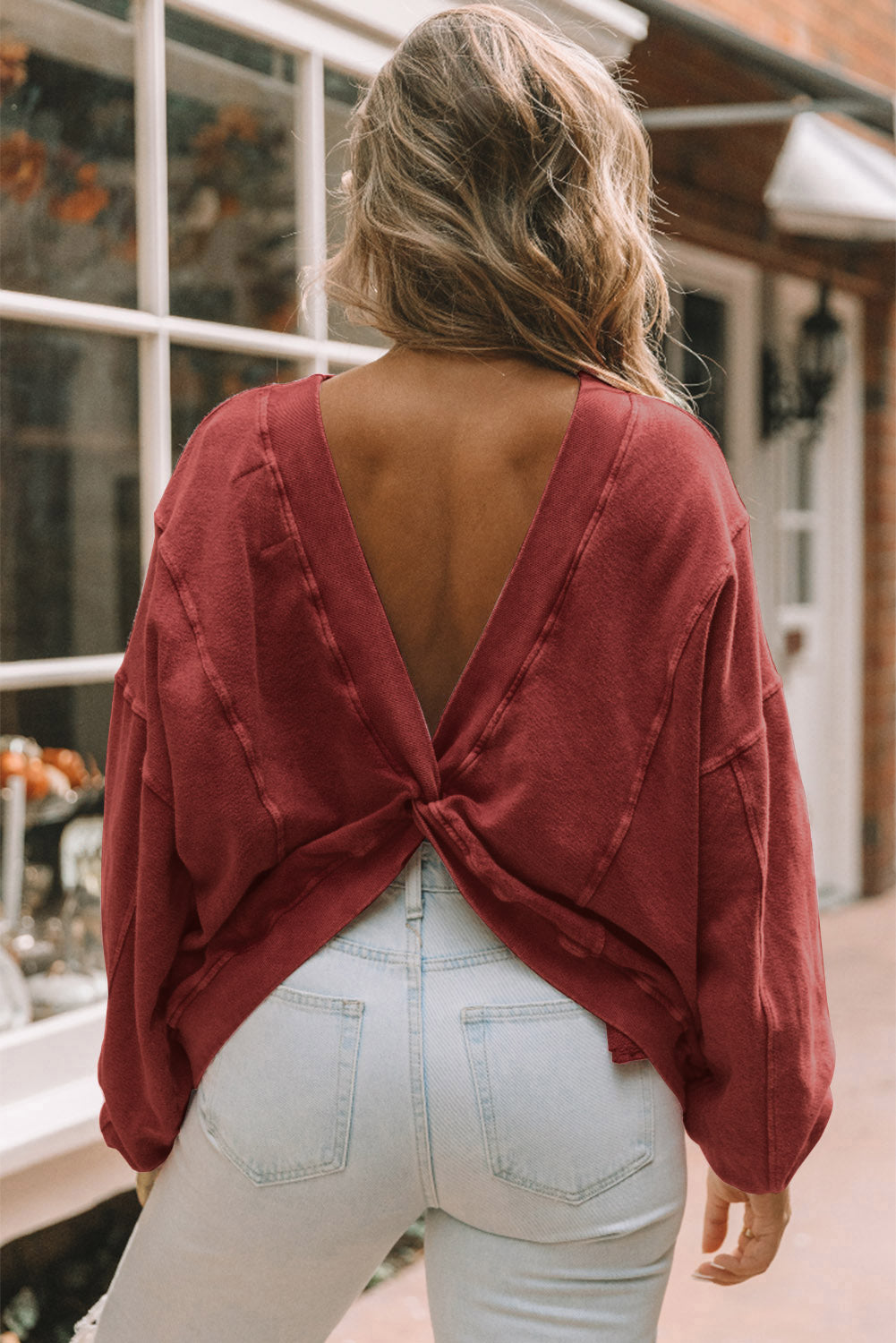 Red Exposed Seam Twist Open Back Oversized Sweatshirt - Premium Tops from Momma Done Gone Crafty- Just $50.40! Shop now at Momma Done Gone Crafty